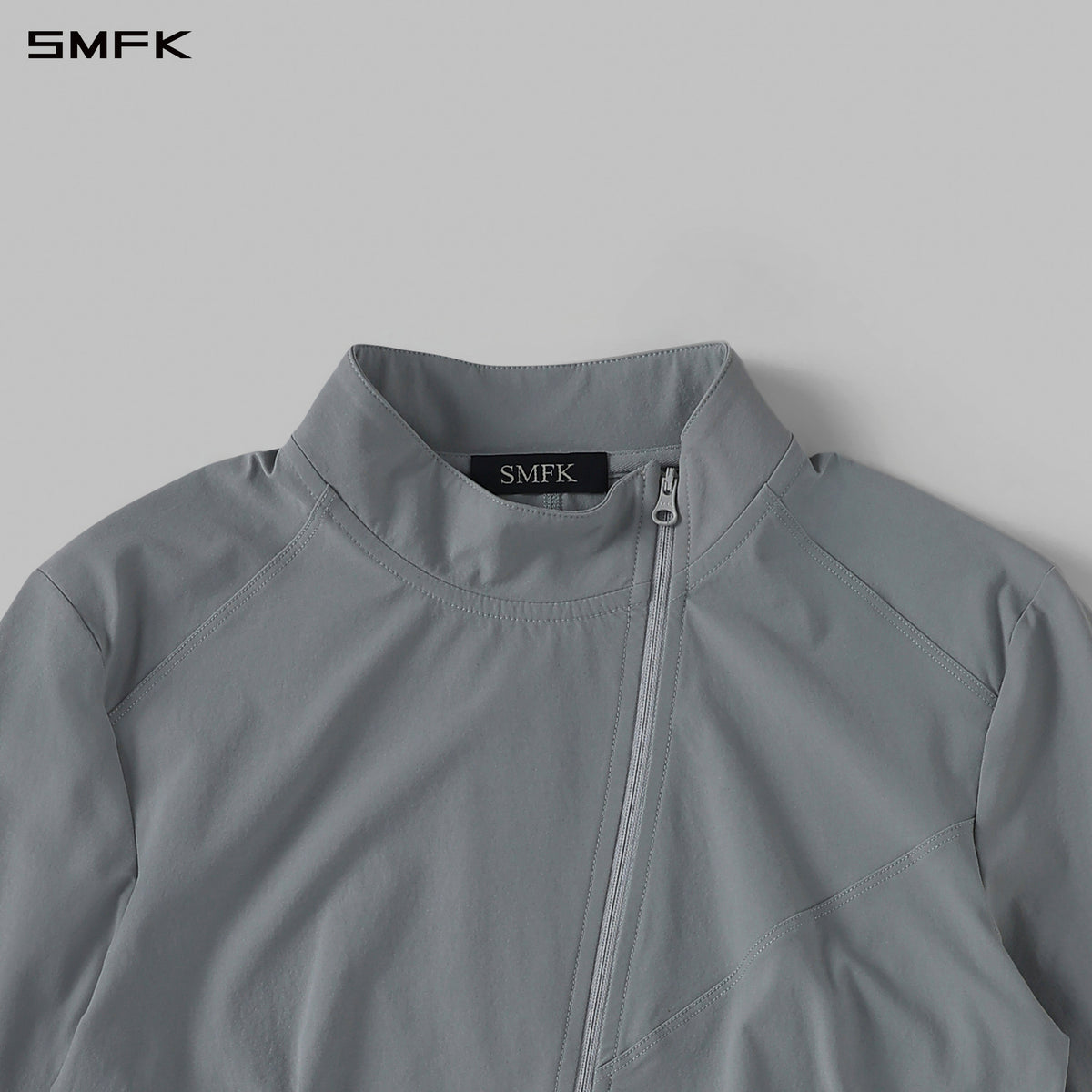 FOCUS OD SLIM ASYMMETRI-ZIP JACKET/66Nylon GLACIER GREY